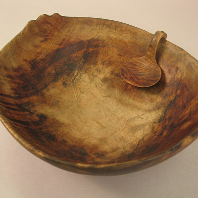 Traditional native American hand carved wooden spoon and feast bowl