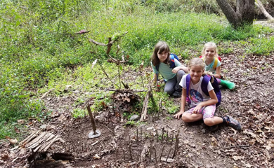 Girls at summer camp in forest created a tiny model village for faeries to reside in